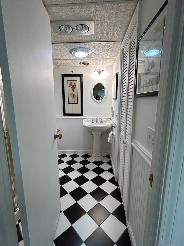 210 Jamestown Rd Unit 210, Stratford, CT 06614 - bathroom with tile patterned floors, an ornate ceiling, and a closet