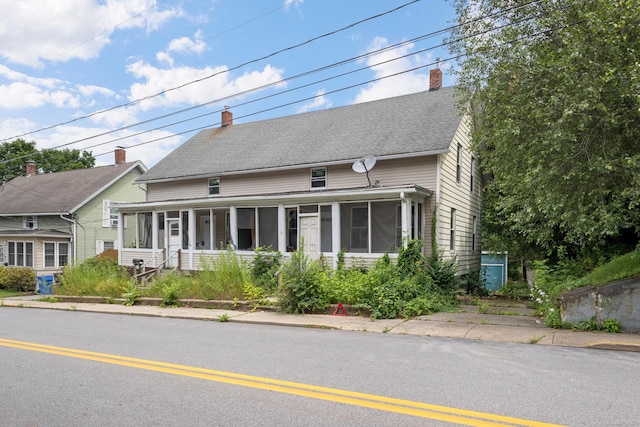 110 Franklin St, Killingly, CT 06239 - view of front of home featuring a sunroom and a chimney