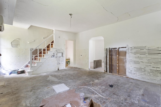 110 Franklin St, Killingly, CT 06239 - unfurnished living room with stairs and arched walkways