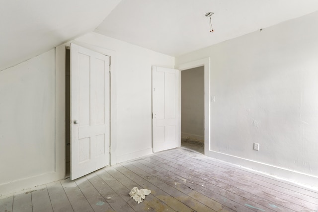 110 Franklin St, Killingly, CT 06239 - additional living space featuring wood-type flooring and vaulted ceiling