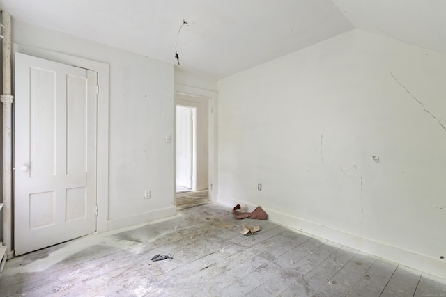 110 Franklin St, Killingly, CT 06239 - unfurnished bedroom featuring baseboards and vaulted ceiling