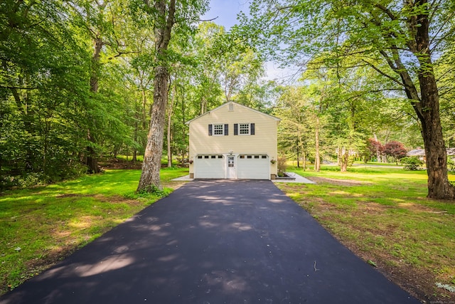 51 Brentley Dr, Shelton, CT 06484 - traditional-style house featuring asphalt driveway, a garage, and a front lawn