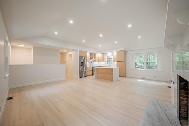 51 Brentley Dr, Shelton, CT 06484 - kitchen with stainless steel appliances, open floor plan, light wood finished floors, a kitchen island, and lofted ceiling