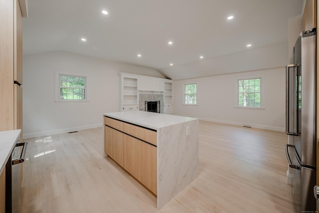 51 Brentley Dr, Shelton, CT 06484 - kitchen featuring stainless steel appliances, lofted ceiling, modern cabinets, healthy amount of natural light, and a kitchen island