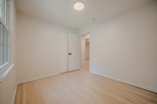 51 Brentley Dr, Shelton, CT 06484 - spare room with wood finished floors and a smoke detector