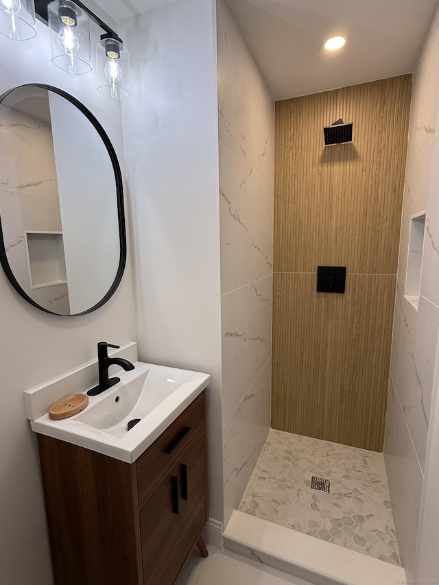 51 Brentley Dr, Shelton, CT 06484 - bathroom featuring a tile shower, vanity, and recessed lighting