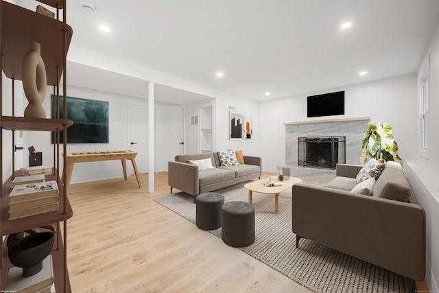 51 Brentley Dr, Shelton, CT 06484 - living area with wood finished floors, a high end fireplace, and recessed lighting