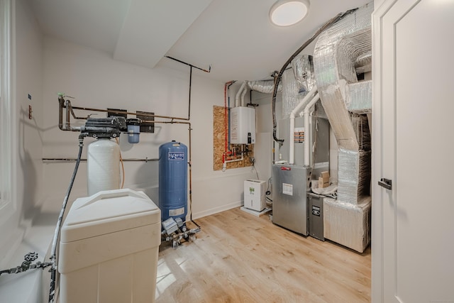 51 Brentley Dr, Shelton, CT 06484 - utility room with tankless water heater and heating unit