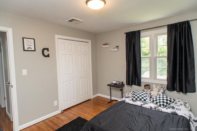 24 Dogwood Ln, Shelton, CT 06484 - bedroom with wood finished floors, multiple windows, and a closet
