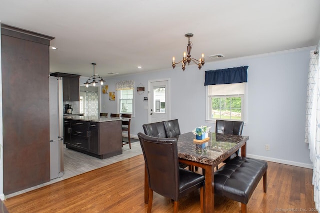 24 Dogwood Ln, Shelton, CT 06484 - dining room with a chandelier, light wood-style floors, ornamental molding, healthy amount of natural light, and recessed lighting