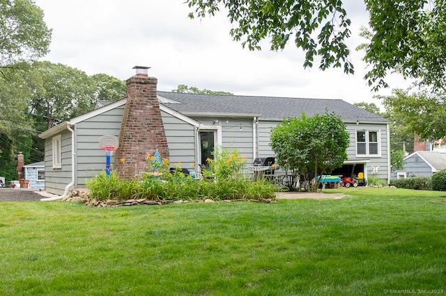 24 Dogwood Ln, Shelton, CT 06484 - rear view of property with a lawn, a chimney, and roof with shingles