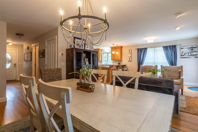 129 Clark Gates Rd, East Haddam, CT 06469 - dining room featuring a chandelier and wood finished floors
