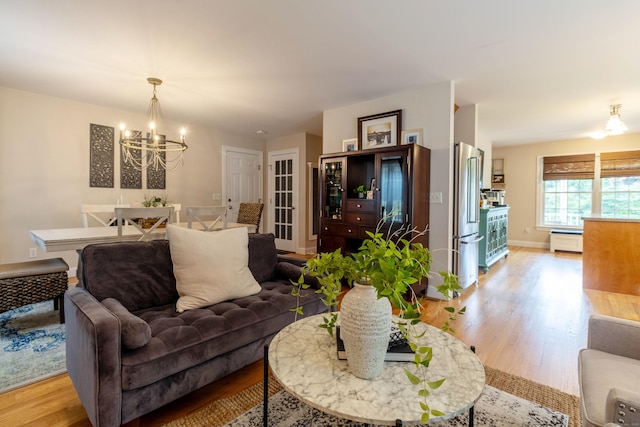 129 Clark Gates Rd, East Haddam, CT 06469 - living area with light wood-type flooring and a chandelier