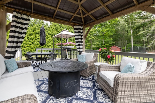 129 Clark Gates Rd, East Haddam, CT 06469 - wooden deck with a gazebo, a storage shed, an outdoor hangout area, and outdoor dining area