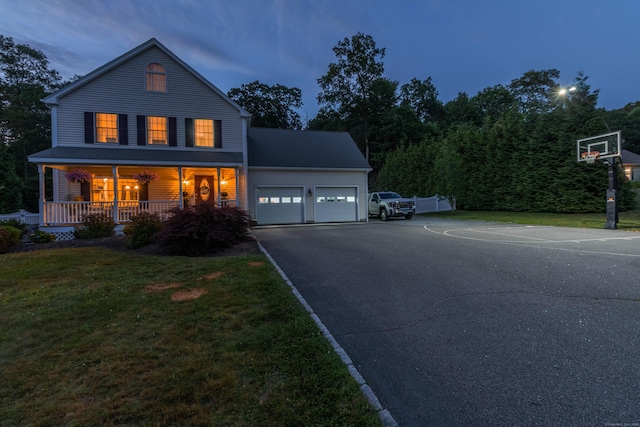 129 Clark Gates Rd, East Haddam, CT 06469 - view of front of property with driveway, a front yard, an attached garage, and a porch