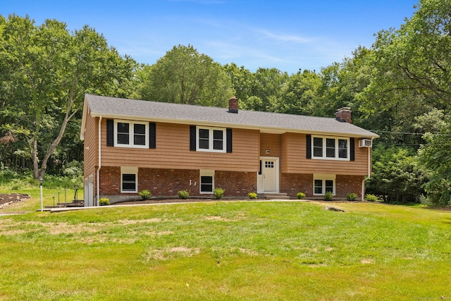 95 Great Ring Rd, Newtown, CT 06482 - raised ranch with a chimney, a front yard, an attached garage, and brick siding