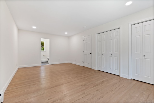 95 Great Ring Rd, Newtown, CT 06482 - unfurnished bedroom featuring light wood finished floors, multiple closets, recessed lighting, and baseboard heating