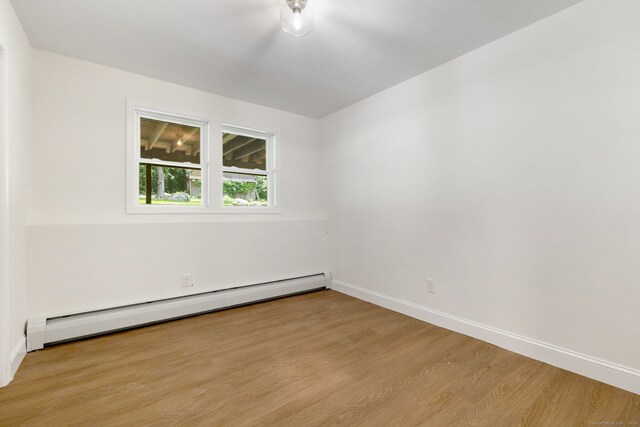 95 Great Ring Rd, Newtown, CT 06482 - unfurnished room featuring a baseboard radiator and light wood-style floors