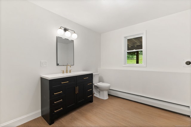 95 Great Ring Rd, Newtown, CT 06482 - bathroom featuring a baseboard heating unit, wood finished floors, and vanity