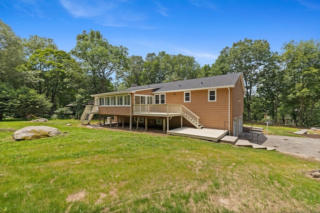 95 Great Ring Rd, Newtown, CT 06482 - rear view of house with stairway, a deck, a lawn, a sunroom, and view of wooded area