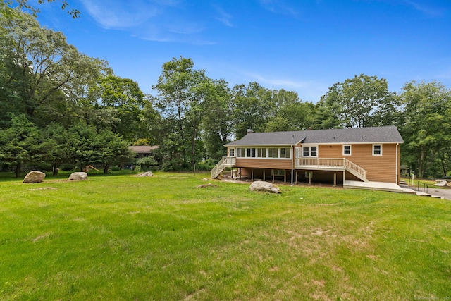 95 Great Ring Rd, Newtown, CT 06482 - rear view of house with stairs, a deck, a yard, and a chimney