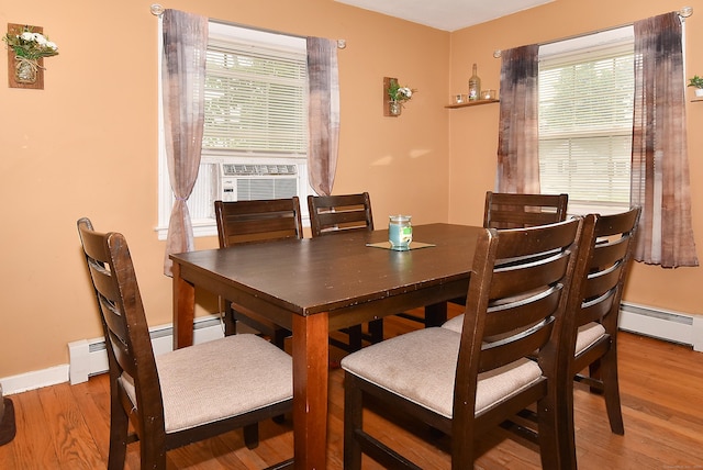 30 Foxcroft Dr, Manchester, CT 06040 - dining area featuring a baseboard radiator and wood finished floors