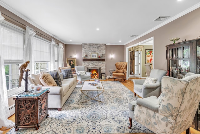 206 Beacon Hill Rd, Trumbull, CT 06611 - living room with crown molding, a fireplace, recessed lighting, light wood-style floors, and a baseboard radiator