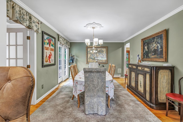 206 Beacon Hill Rd, Trumbull, CT 06611 - dining room featuring a chandelier, ornamental molding, light wood-type flooring, and a baseboard radiator
