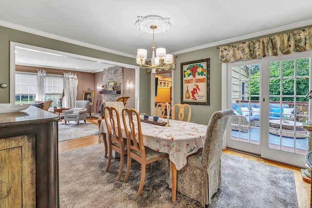 206 Beacon Hill Rd, Trumbull, CT 06611 - dining space with wood finished floors, a chandelier, and crown molding