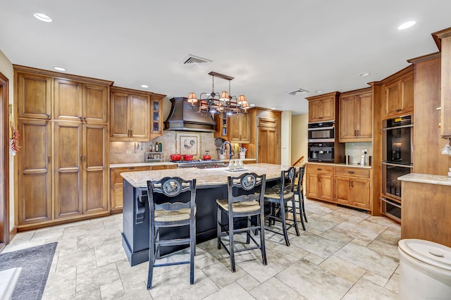 206 Beacon Hill Rd, Trumbull, CT 06611 - kitchen with stainless steel double oven, premium range hood, decorative backsplash, recessed lighting, and brown cabinetry