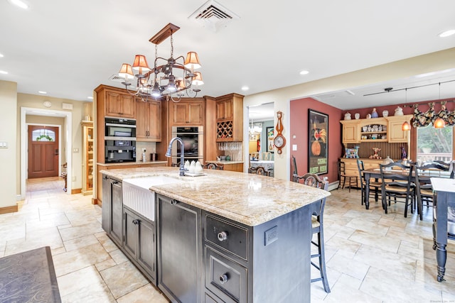 206 Beacon Hill Rd, Trumbull, CT 06611 - kitchen featuring light stone finish flooring, a chandelier, decorative light fixtures, light stone countertops, and recessed lighting