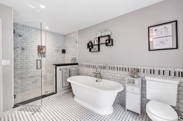 206 Beacon Hill Rd, Trumbull, CT 06611 - bathroom featuring a freestanding bath, a stall shower, tile walls, a wainscoted wall, and recessed lighting