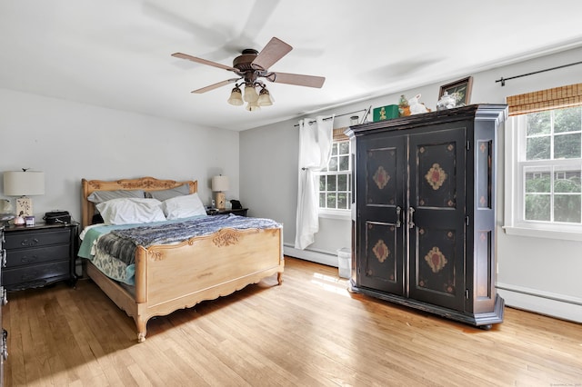 206 Beacon Hill Rd, Trumbull, CT 06611 - bedroom featuring a baseboard radiator, wood finished floors, and ceiling fan