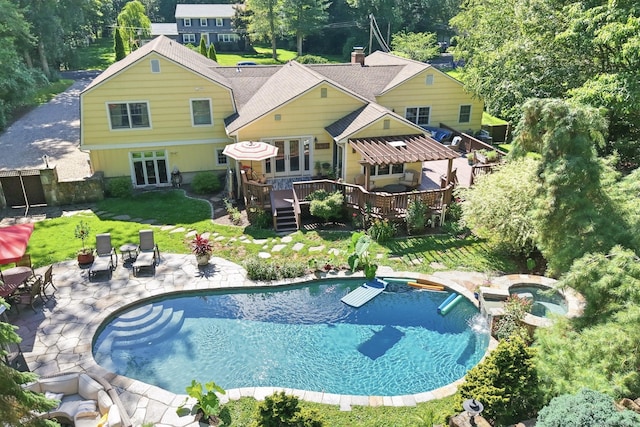 206 Beacon Hill Rd, Trumbull, CT 06611 - view of pool with a deck, a patio, a pool with connected hot tub, a lawn, and french doors