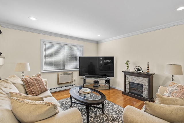 60 Alvord Ln Apt 19, Stamford, CT 06902 - living area featuring a baseboard radiator, ornamental molding, wood finished floors, a stone fireplace, and a wall mounted air conditioner