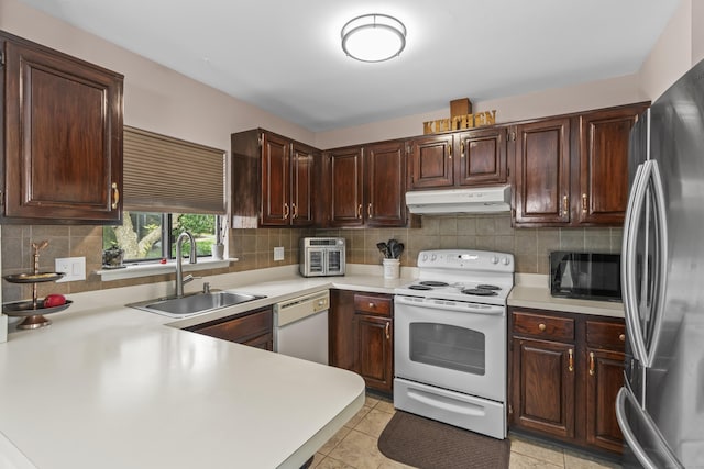 60 Alvord Ln Apt 19, Stamford, CT 06902 - kitchen featuring white appliances, under cabinet range hood, light countertops, and decorative backsplash