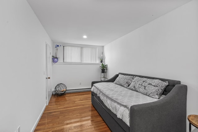 60 Alvord Ln Apt 19, Stamford, CT 06902 - bedroom featuring wood finished floors, recessed lighting, and a baseboard heating unit