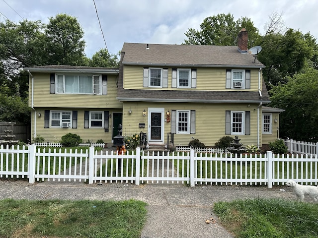 54 Carmel St, Hamden, CT 06518 - view of front of home featuring a chimney, a fenced front yard, and entry steps