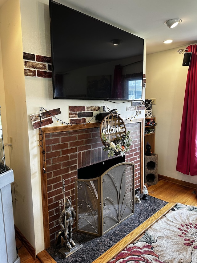 54 Carmel St, Hamden, CT 06518 - detailed view of a brick fireplace and wood finished floors