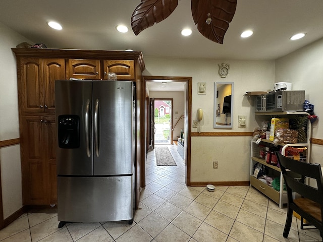 54 Carmel St, Hamden, CT 06518 - kitchen featuring stainless steel refrigerator with ice dispenser, light tile patterned floors, and recessed lighting