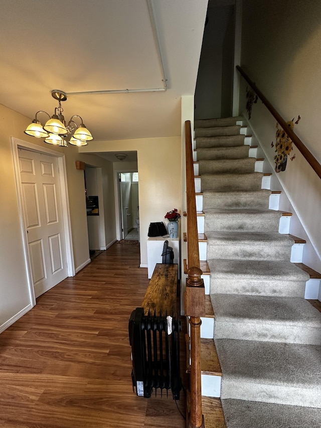 54 Carmel St, Hamden, CT 06518 - stairs featuring wood finished floors and a chandelier