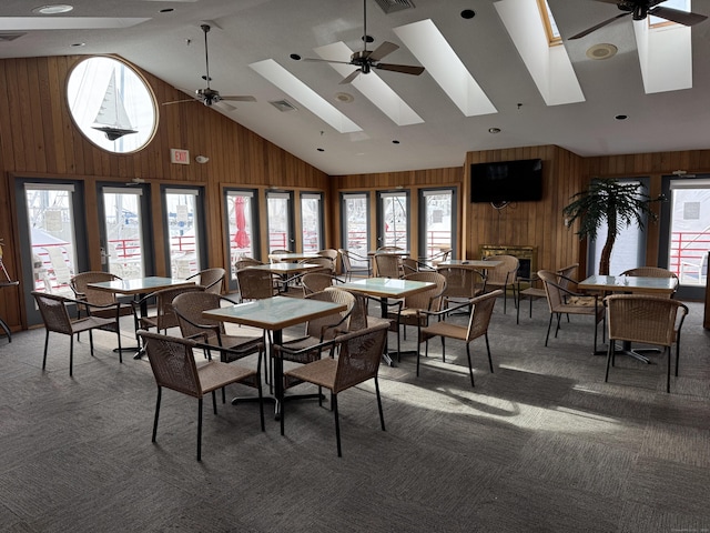 100 Pequot Ave Unit 3530, New London, CT 06320 - dining space with healthy amount of natural light, wooden walls, light colored carpet, high vaulted ceiling, and a ceiling fan