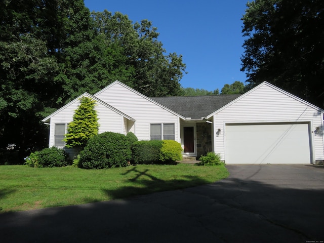 1200 Peck Ln, Cheshire, CT 06410 - ranch-style home with an attached garage, asphalt driveway, and a front yard