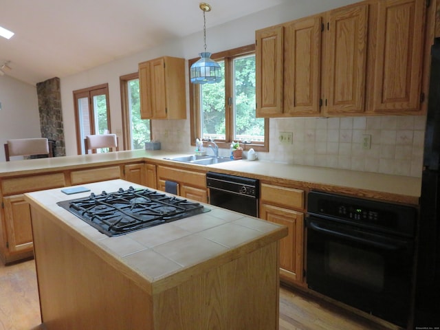 1200 Peck Ln, Cheshire, CT 06410 - kitchen featuring black appliances, light wood finished floors, decorative backsplash, plenty of natural light, and vaulted ceiling