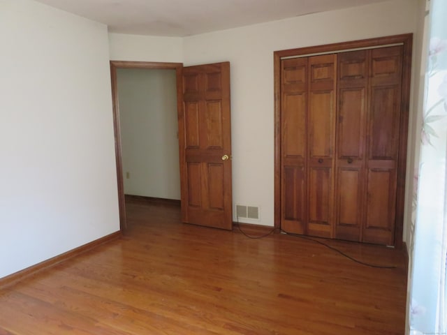 1200 Peck Ln, Cheshire, CT 06410 - unfurnished bedroom with light wood-type flooring and a closet