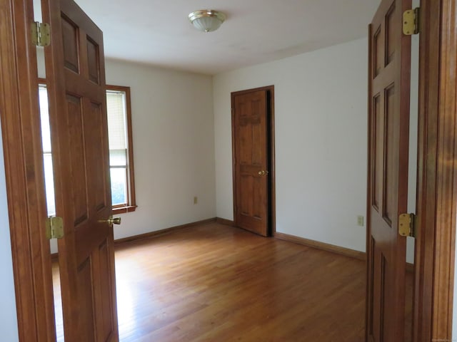 1200 Peck Ln, Cheshire, CT 06410 - spare room featuring light wood-style floors and baseboards