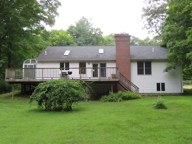 1200 Peck Ln, Cheshire, CT 06410 - rear view of house with a wooden deck, a yard, a chimney, and a shingled roof
