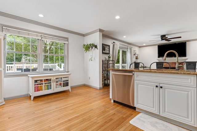 41 Arlington Rd, Stamford, CT 06902 - kitchen featuring dishwasher, ornamental molding, ceiling fan, light wood-style flooring, and healthy amount of natural light