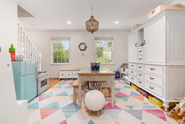 41 Arlington Rd, Stamford, CT 06902 - rec room featuring healthy amount of natural light, a chandelier, crown molding, recessed lighting, and light wood-style floors