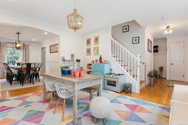 41 Arlington Rd, Stamford, CT 06902 - dining space featuring a chandelier, hardwood / wood-style flooring, crown molding, stairway, and recessed lighting